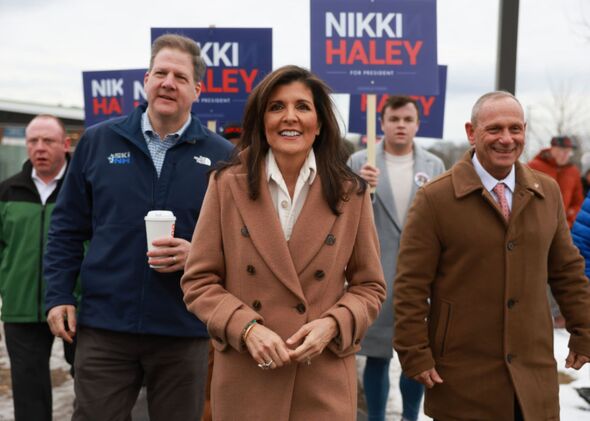 Nikki Haley is joined by New Hampshire Gov. Chris Sununu as they visit a polling location.