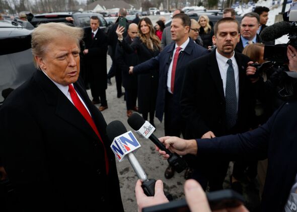Trump speaking to reporters at a polling site.