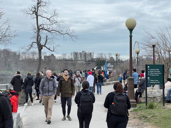 People walk around Niagara Falls ahead of eclipse