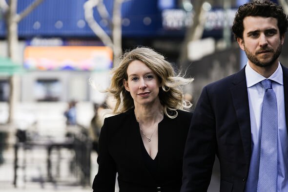 Former Theranos CEO Elizabeth Holmes alongside her boyfriend Billy Evans, walks back to her hotel fo