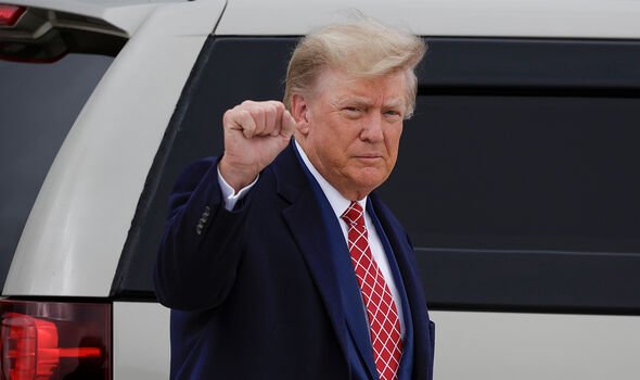 donald trump holding up a closed fist