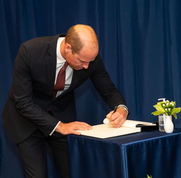 Prince William signs guest book