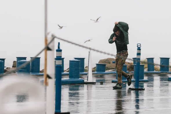Man stuck in the rain in Malibu